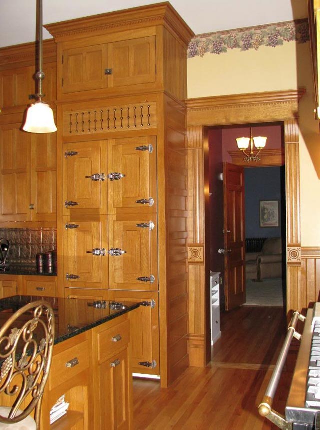 View of ice box and hallway.