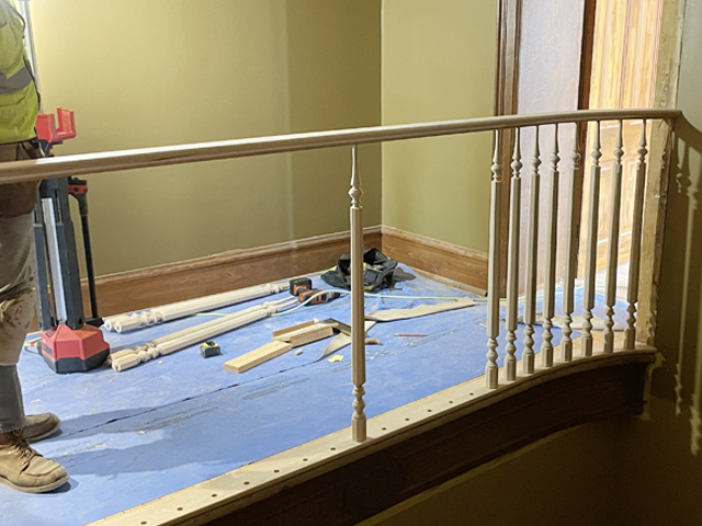 Installation of hallway railing, spindles and trim work restored and installed.